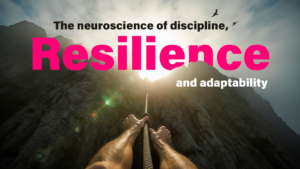 Hands climbing a mountain with rope, symbolizing the neuroscience of discipline, resilience, and adaptability.